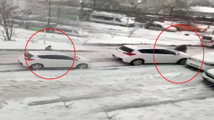 Akılalmaz görüntü! Direksiyonu bırakıp kendini aracın önüne attı