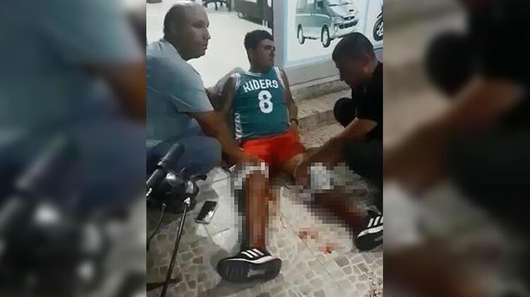 Bacaklarından vuruldu, yerde oturarak ambulansı bekledi