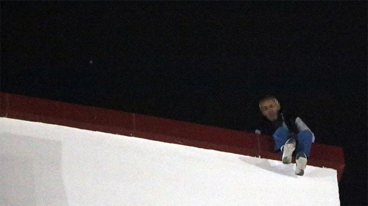 Eşinin eve dönmesini isteyip hastanenin çatısına çıktı