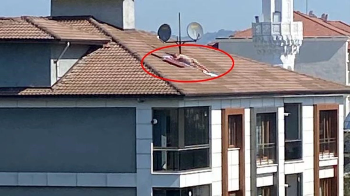 Görüntü Türkiye'den! Çatıda çıplak güneşlenen erkek, polis sirenini duyunca kaçtı