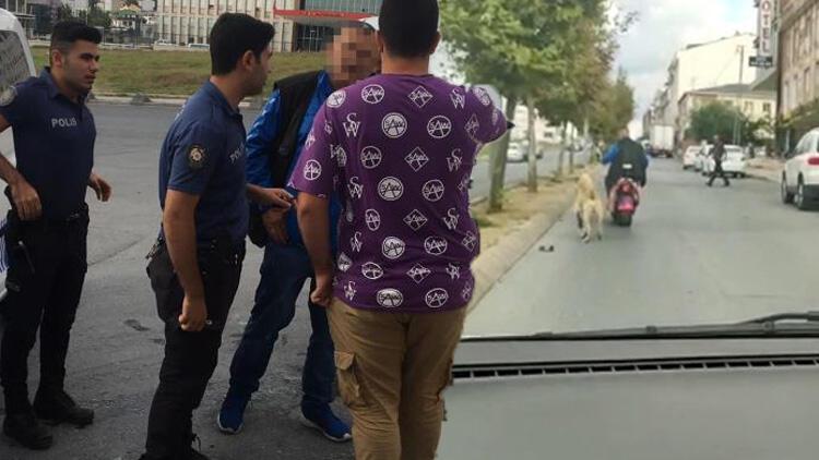 Köpeği motosikletine bağlayarak götüren şahsa tepki