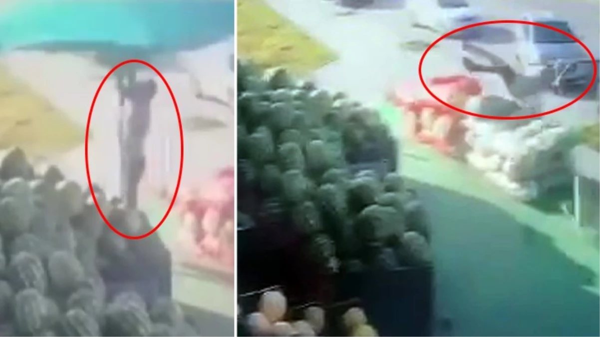 Rüzgarda havalanan şemsiyeyi kapatmaya çalışan manav çalışanı, 5 metre uzaklıktaki refüje uçtu