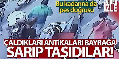Çaldıkları antikayı bayrağa sarıp taşıdılar