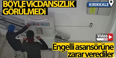 Engelli asansörüne zarar veren iki genç kamerada