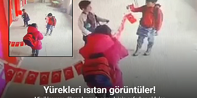 Erzurum’dan yürekleri ısıtan görüntüler: Minikler yere düşen bayrağı asmak için seferber oldular