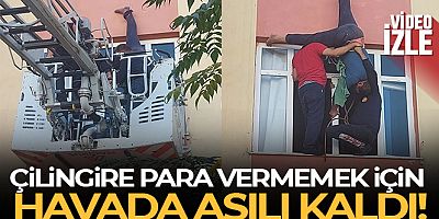 Evine çatıdan sarkıp pencereden girmek istedi, halat kısa gelince asılı kaldı
