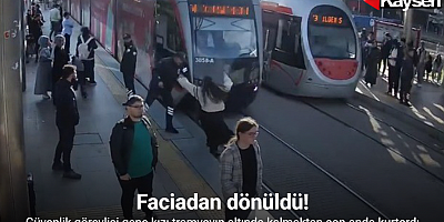 Güvenlik görevlisi genç kızı tramvayın altında kalmaktan son anda kurtardı: O anlar kameraya yansıdı