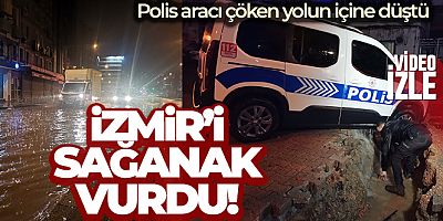 İzmir'i sağanak vurdu: Polis aracı çöken yolun içine düştü