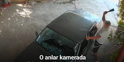 Kadına ait otomobile satır ve bıçakla zarar verdi: O anlar kamerada