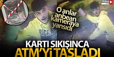 Kartı sıkışınca ATM'yi taşladı