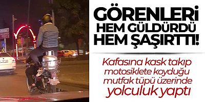 Motosikletteki tüp üzerinde tehlikeli yolculuk