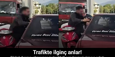 Otomobil sürücüsü dışarıya çıkmayınca motosikletli camdan içeri girmeye çalıştı