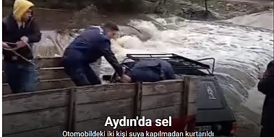 Otomobildeki iki kişi sele kapılmadan kurtarıldı