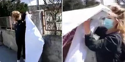 Pankartı söktü, çantasına koyup evine götürdü