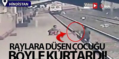 Raylara düşen çocuğu son anda kurtardı