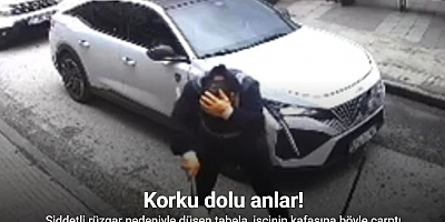 Şiddetli rüzgar nedeniyle düşen tabela, işçinin kafasına böyle çarptı: O anlar güvenlik kamerasında