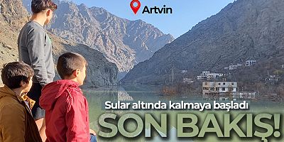 Sular altında kalan evlerine son kez baktılar