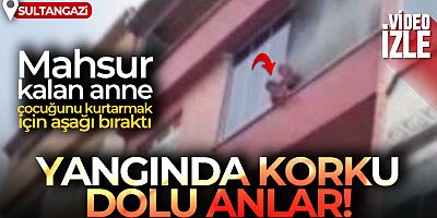 Sultangazi'de yangın paniği: Mahsur kalan anne, kurtarmak için çocuğunu aşağı bıraktı