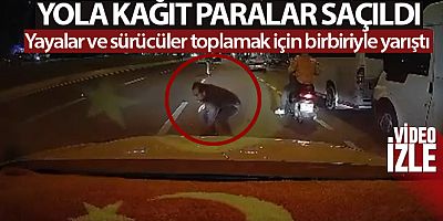 Yola kağıt paralar saçıldı, yayalar ve sürücüler toplamak için birbiriyle yarıştı