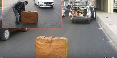 Yolda kalan otomobili için bavullu önlem