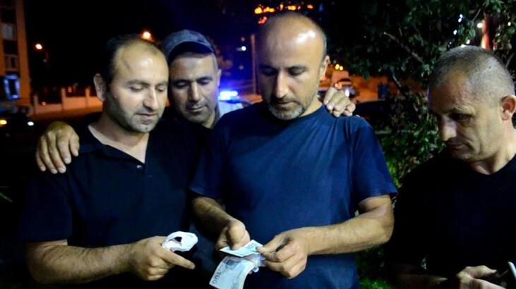 Yol ortasında poşet dolu para buldu